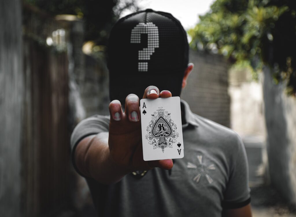 Man holding a playing card